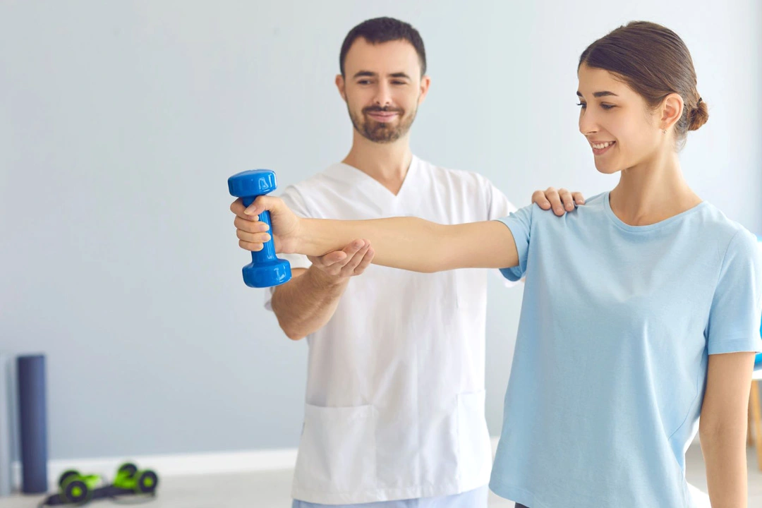 Healthcare professional assisting a patient in performing an arm exercise with a dumbbell during a functional capacity evaluation.